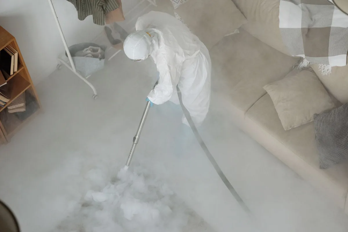 Biohazard cleanup technician in protective equipment, Harbor Beach, MI